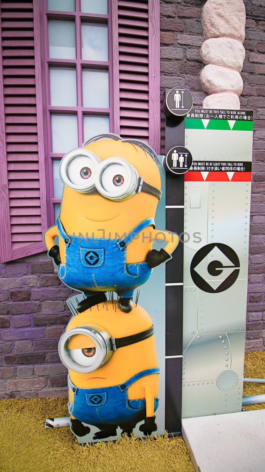 OSAKA, JAPAN - Nov 13, 2019 : Close up HAPPY MINION statue in Universal Studios Japan. Minions are famous character from Despicable Me animation.