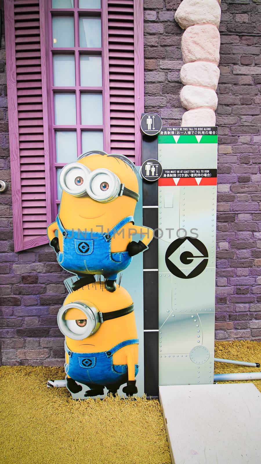 OSAKA, JAPAN - Nov 13, 2019 : Close up HAPPY MINION statue in Universal Studios Japan. Minions are famous character from Despicable Me animation. by USA-TARO