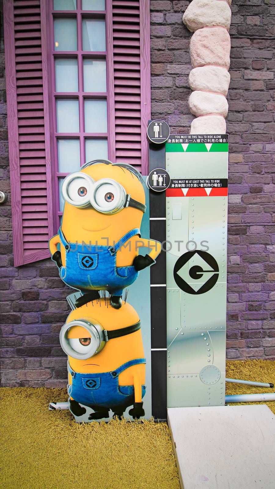 OSAKA, JAPAN - Nov 13, 2019 : Close up HAPPY MINION statue in Universal Studios Japan. Minions are famous character from Despicable Me animation. by USA-TARO