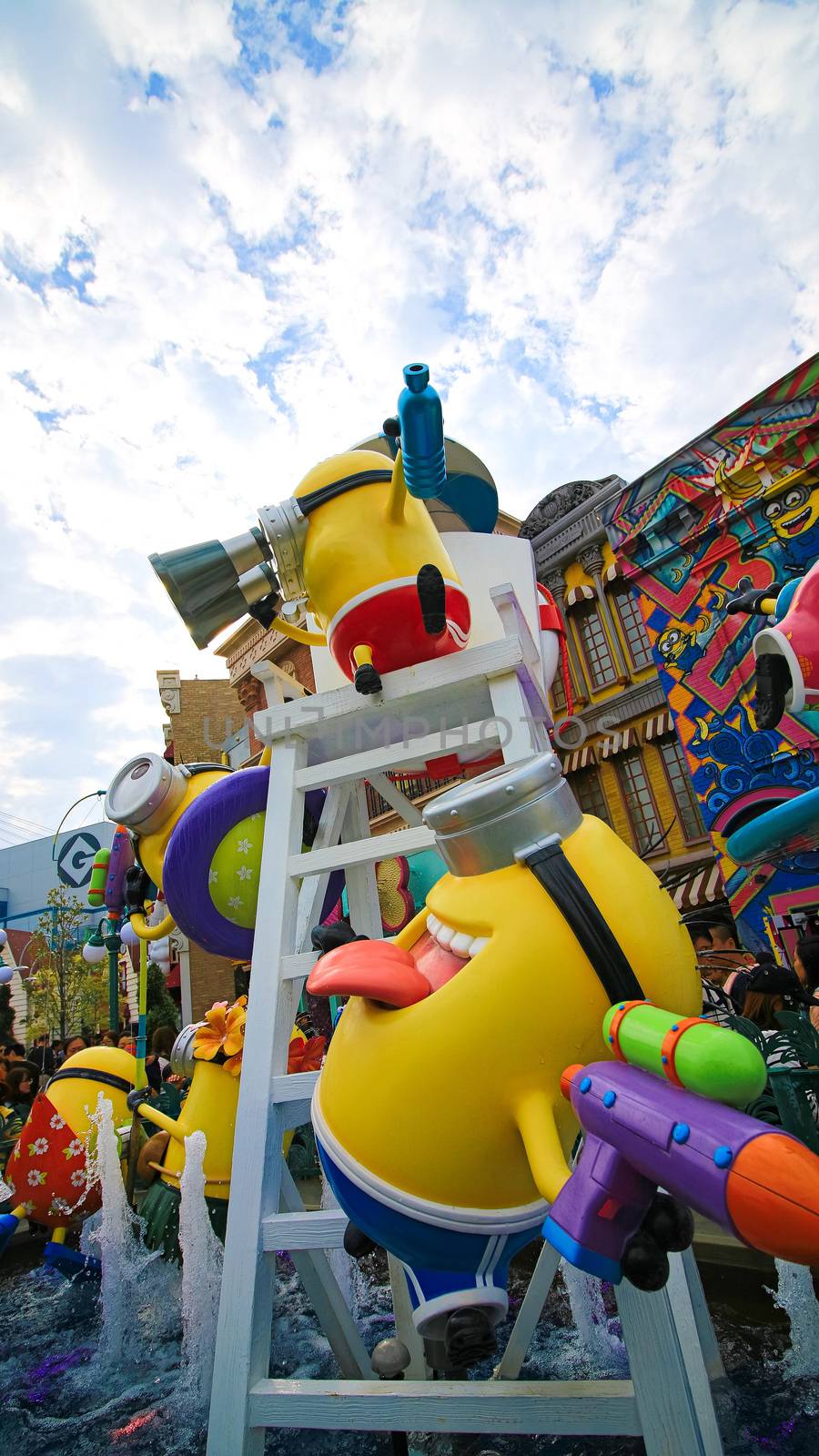 OSAKA, JAPAN - November 03, 2017 : Statue of MINIONS at MINION PARK ENTRANCE in Universal Studios JAPAN.  Minions are famous characters from Despicable Me animation. by USA-TARO