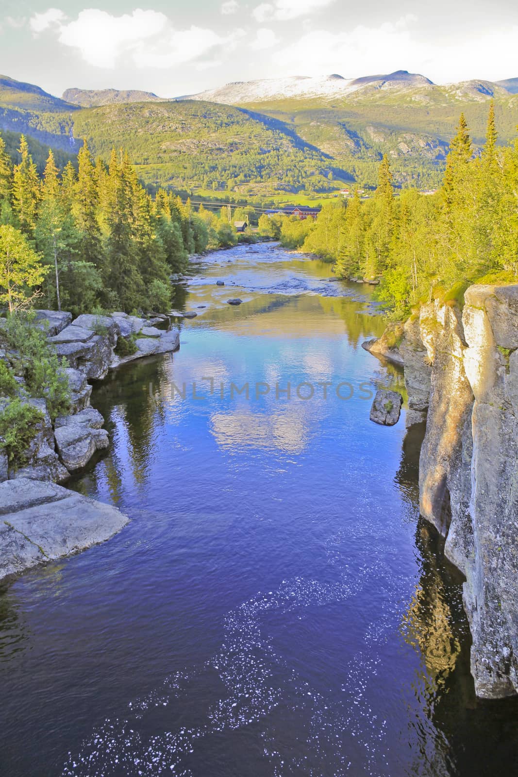 River of the beautiful waterfall Rjukandefossen with mountain and village views of Hemsedal, Buskerud, Norway.