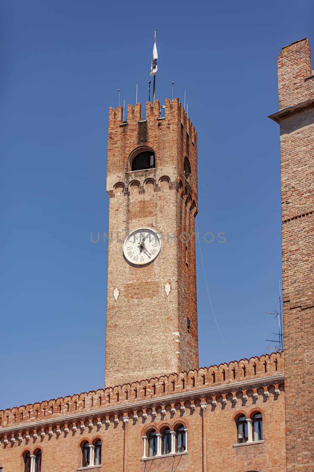 Clock tower or Torre Civica in Italian in Treviso in Italy in a sunny day