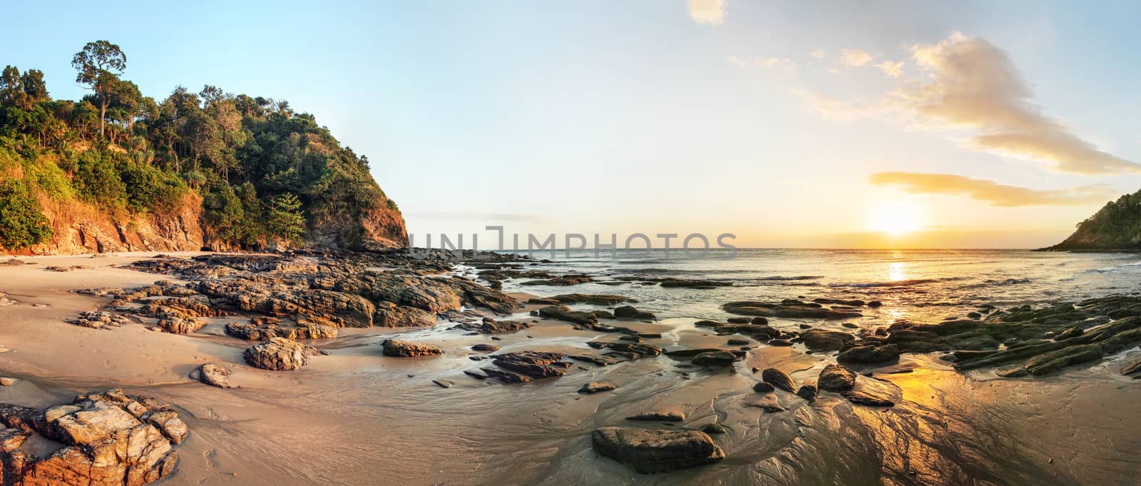 High resolution wide panorama of sunset on Koh Lanta beach during low tide.