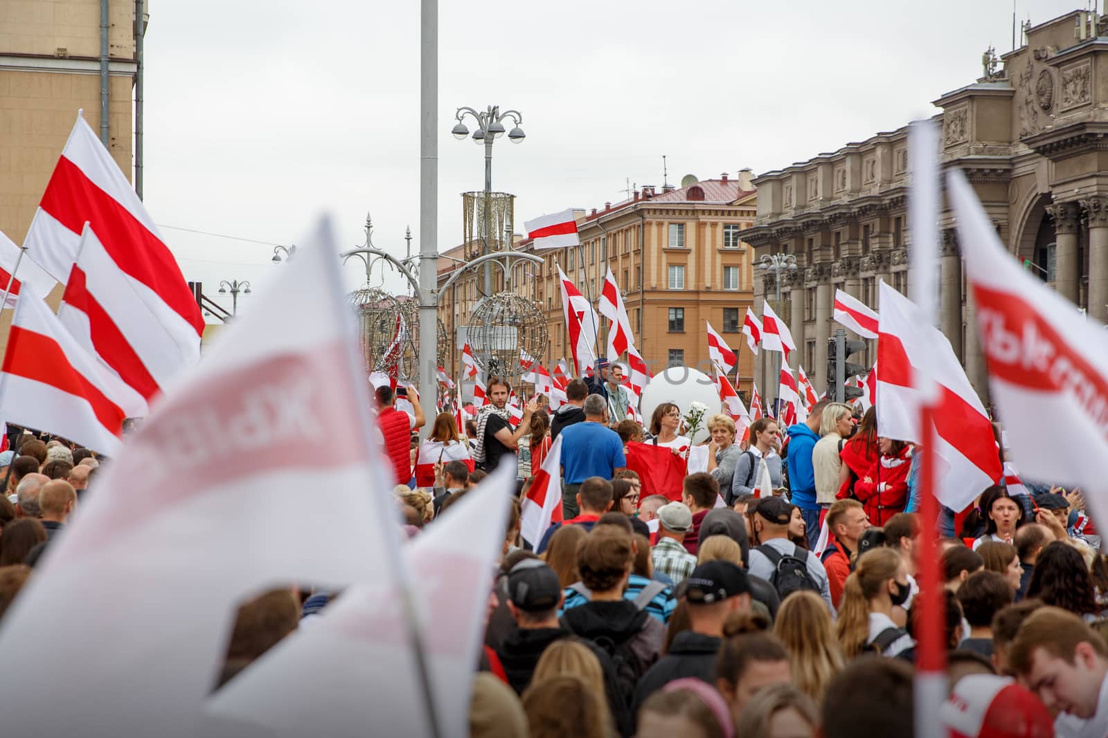 Minsk, Belarus - 23.08.20: Belarus protest on the main Minsk square. Many people and new Belarus flags by 9parusnikov