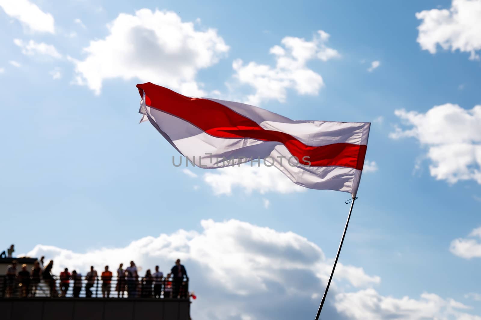 White-red-white flag on blue sky background. Historical Belarus authentic flag.