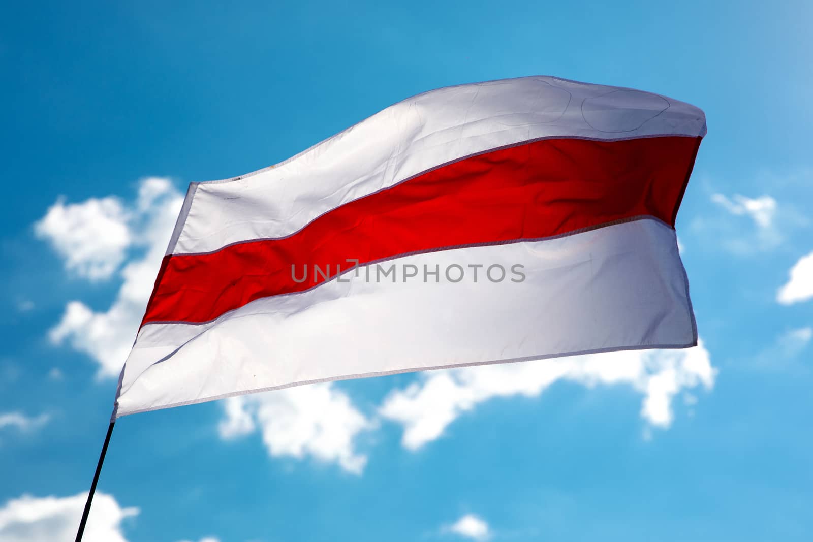 White-red-white flag on blue sky background. Historical Belarus authentic flag by 9parusnikov