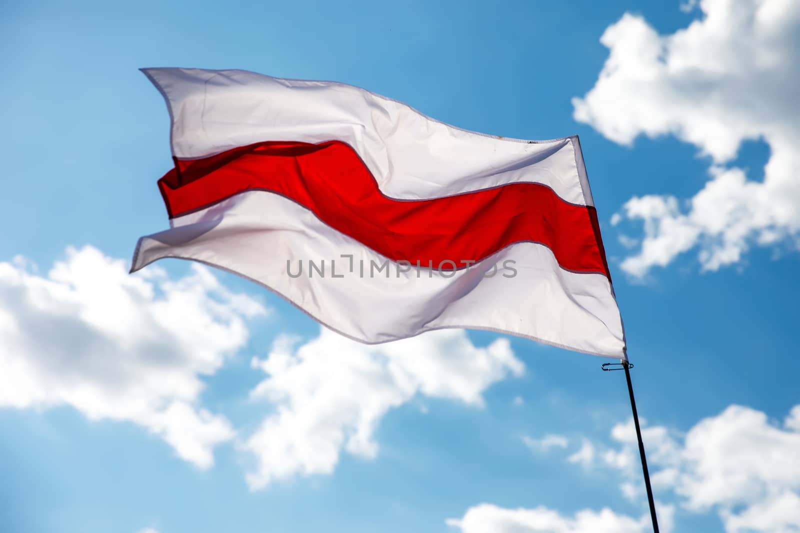 White-red-white flag on blue sky background. Historical Belarus authentic flag by 9parusnikov