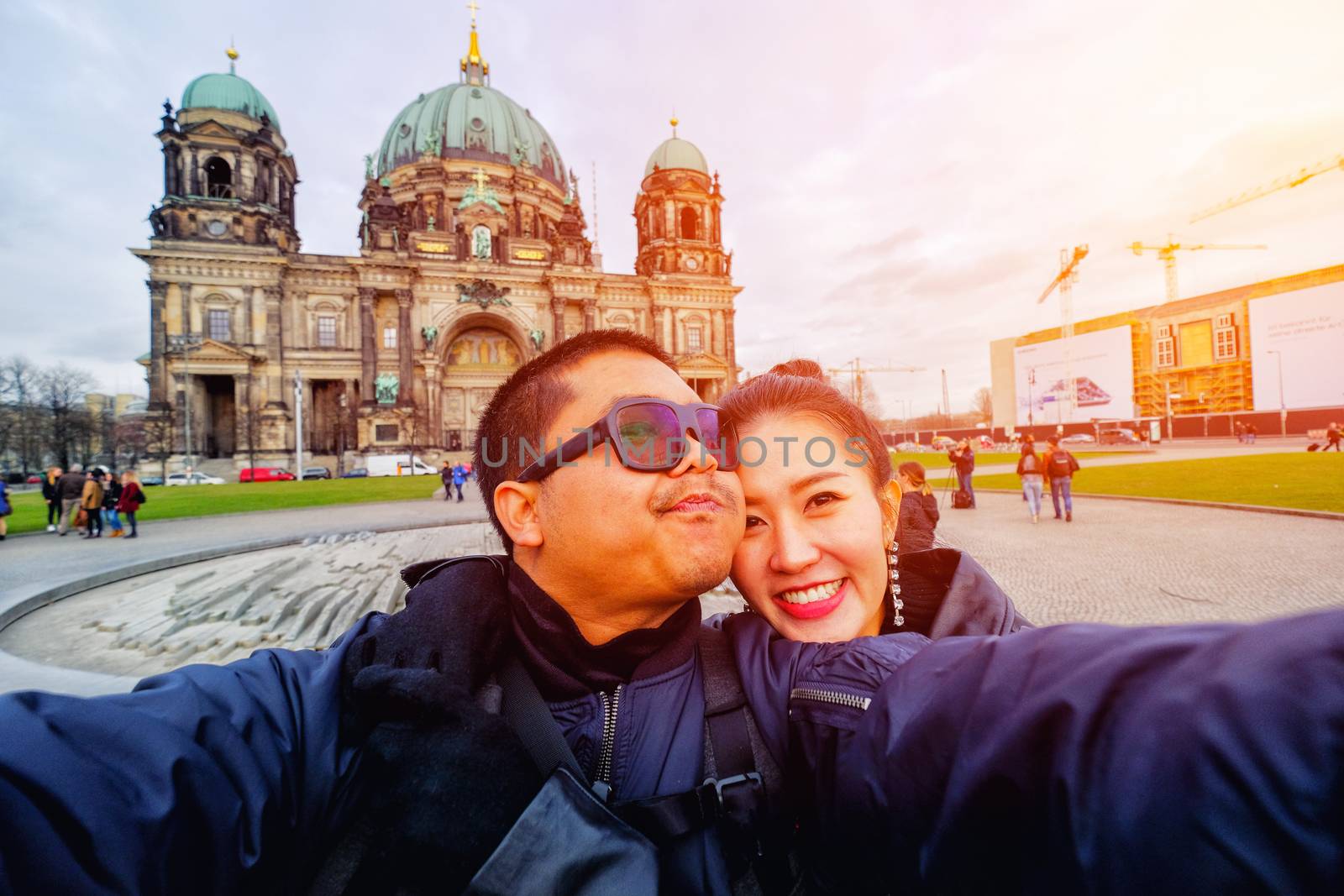 Young Couple Tourists selfie with mobile phone near Berlin Cathe by Surasak