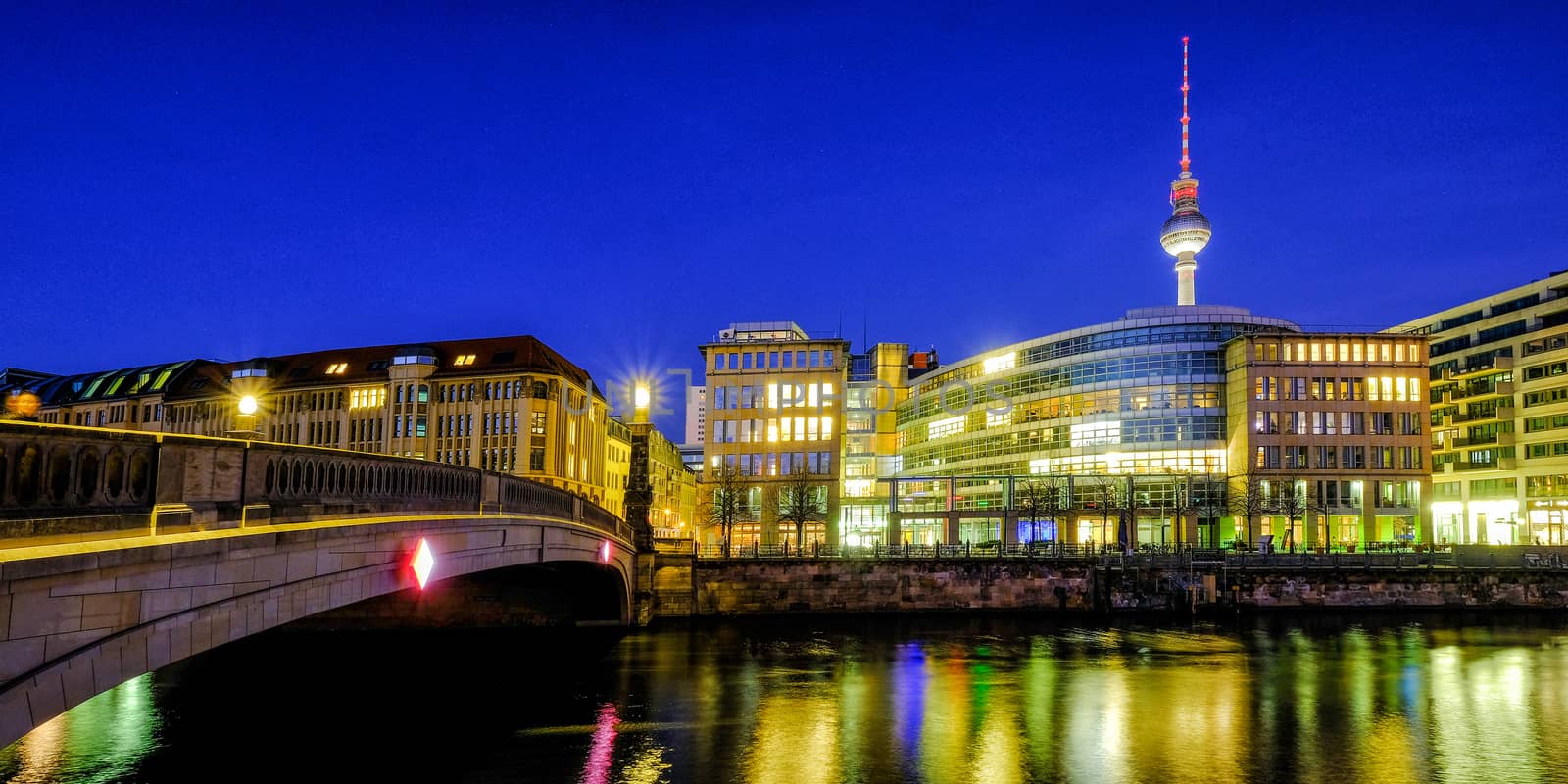 Classic view of Berlin skyline on the river in twilight during blue hour at dusk, Germany