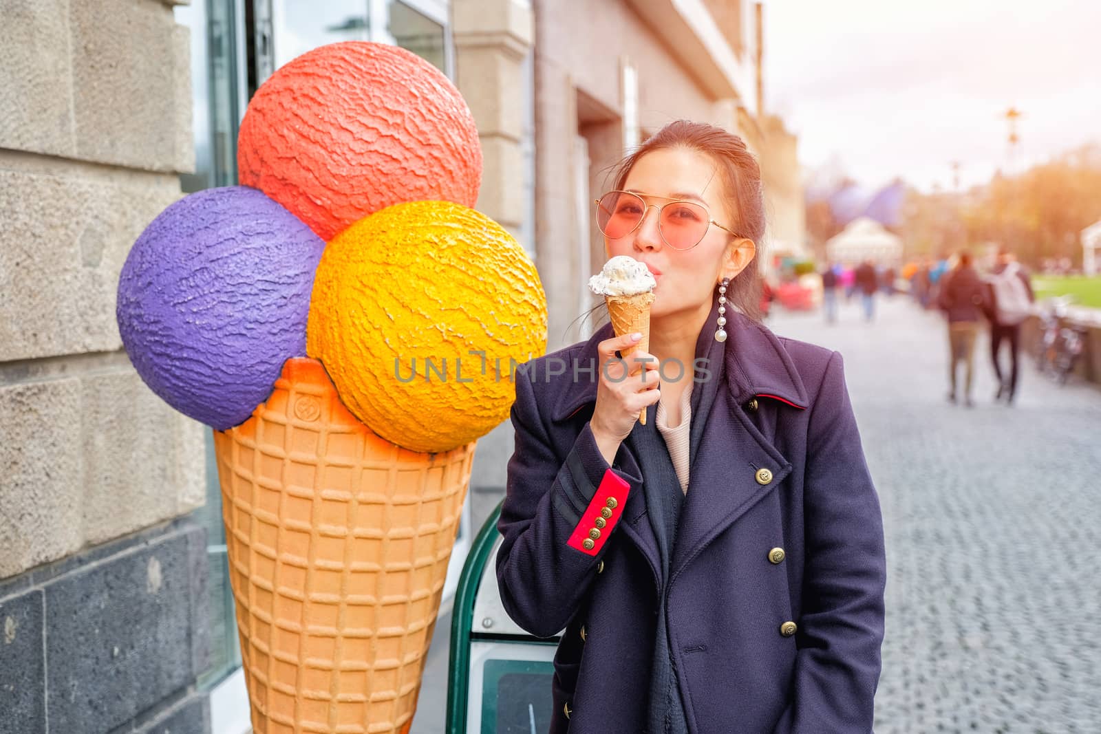 Happy Woman enjoy eating ice cream cones  by Surasak