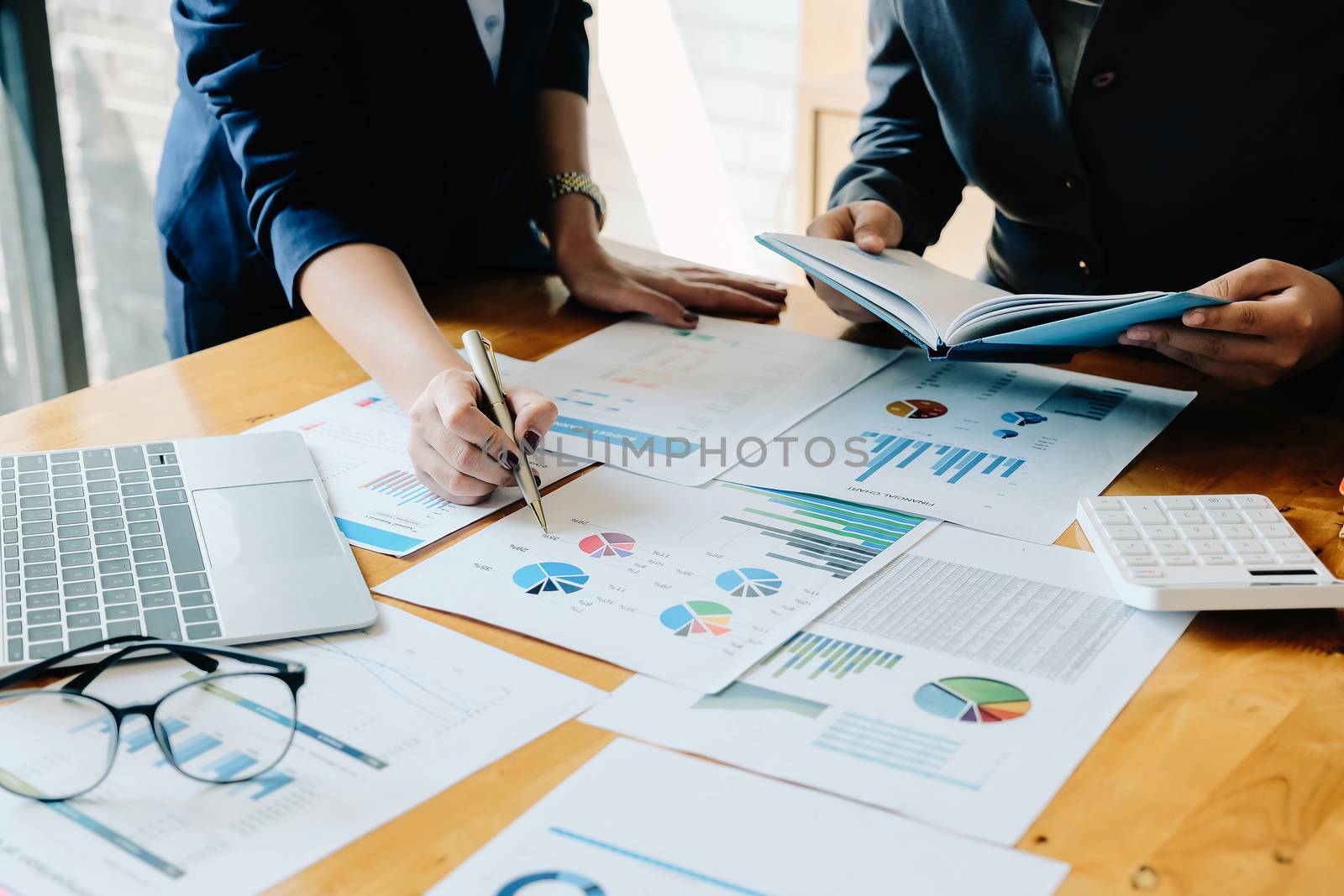 financial advisory services. Group of business advisor showing plan of investment to clients in the consultancy office.