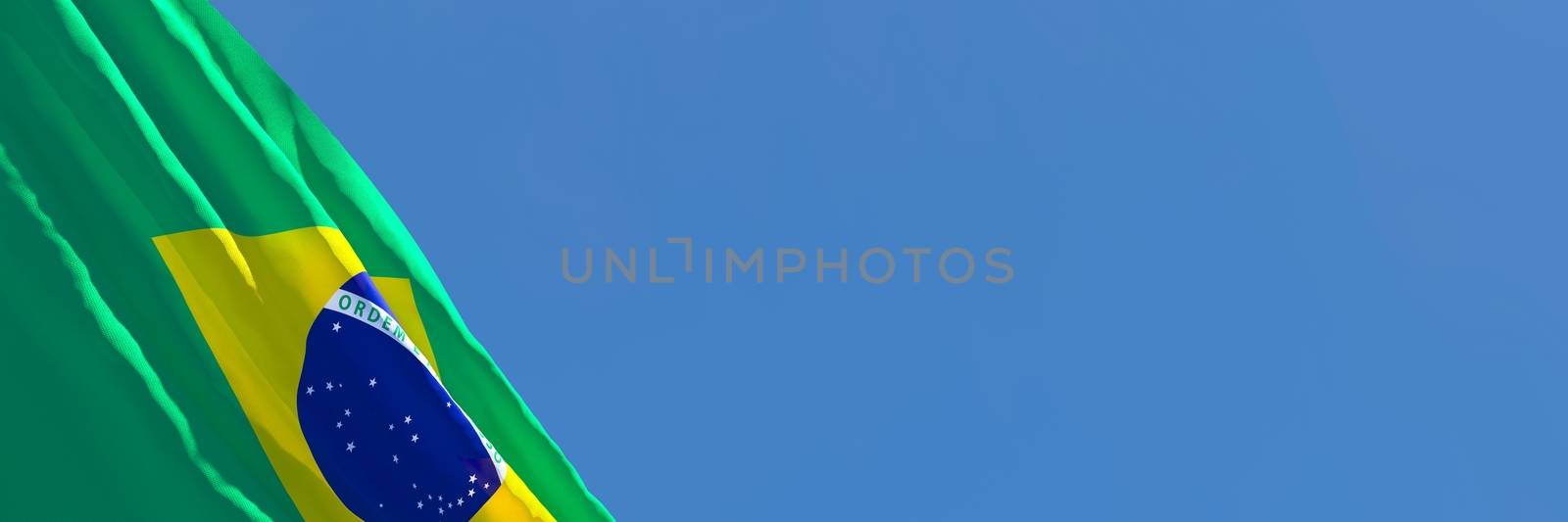 3D rendering of the national flag of Brazil waving in the wind against a blue sky