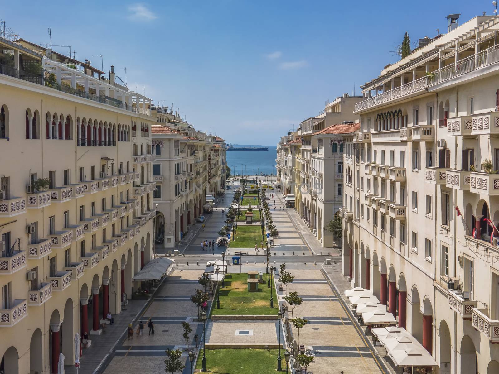 Day panorama of pedestrian area of central square with low rise traditional buildings on a sunny day.