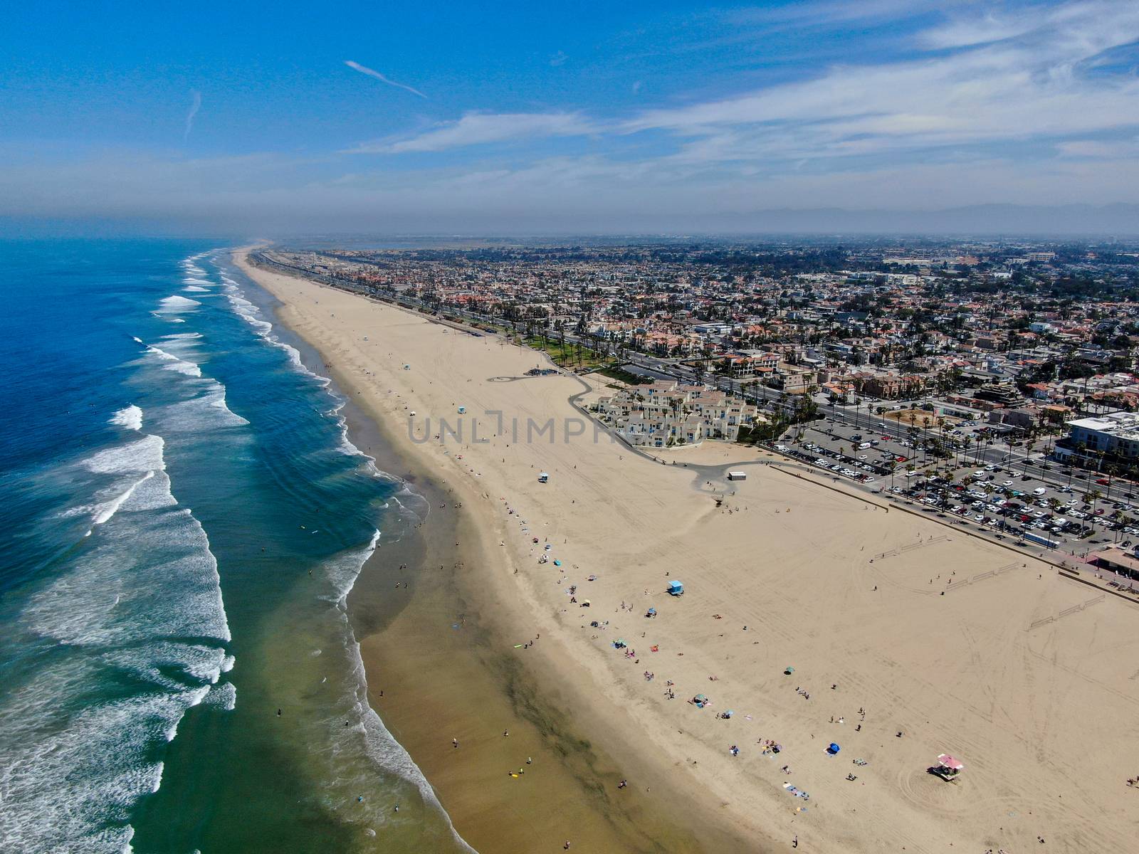 Aerial view of Huntington Beach and coastline during hot blue sunny summer day by Bonandbon