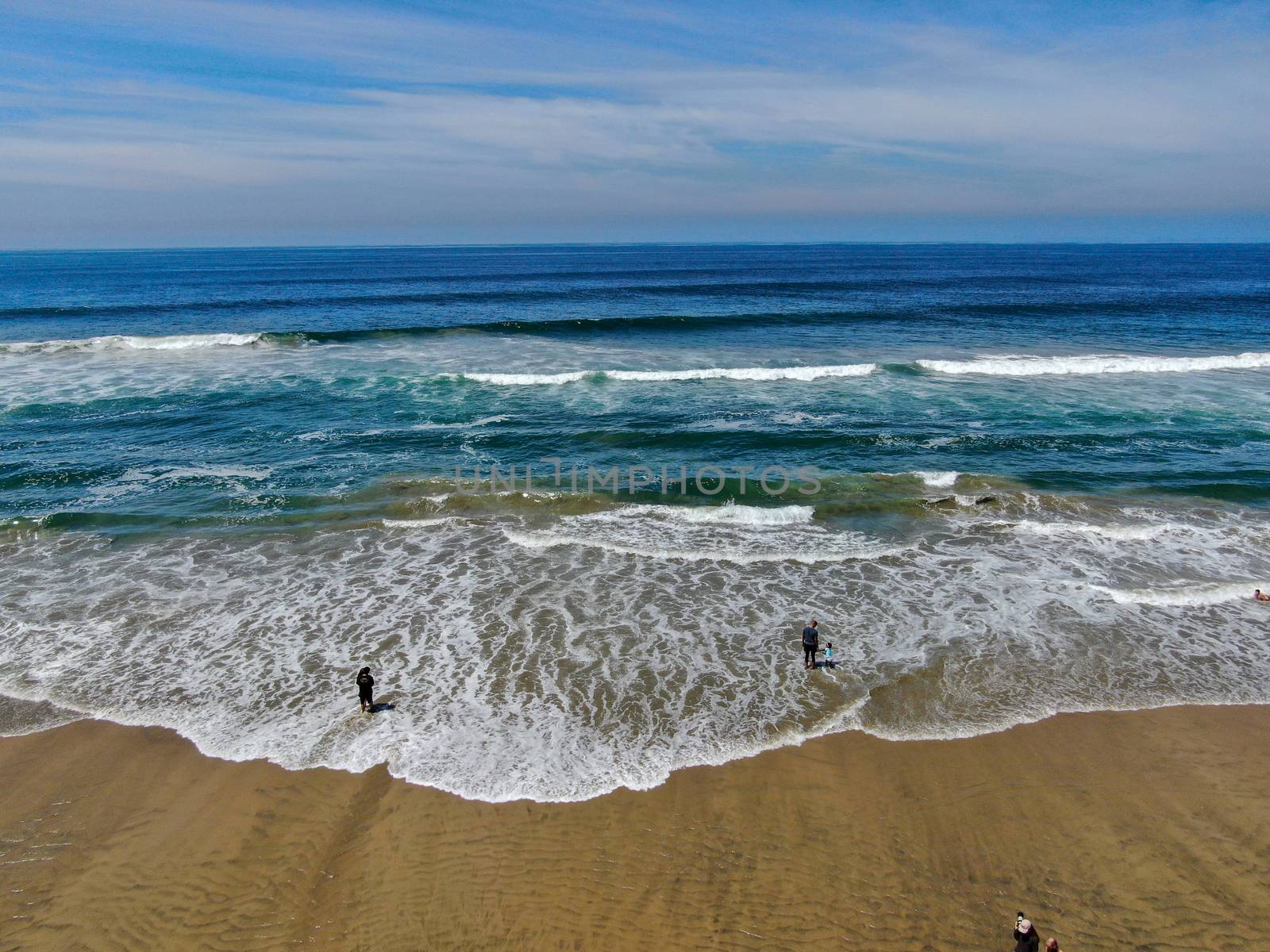 Aerial view of Huntington Beach and coastline during hot blue sunny summer day, Southeast of Los Angeles. California. destination for holiday and surfer