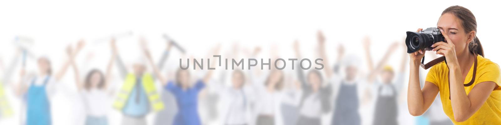 Young photographer girl with camera over many customers people isolated white background