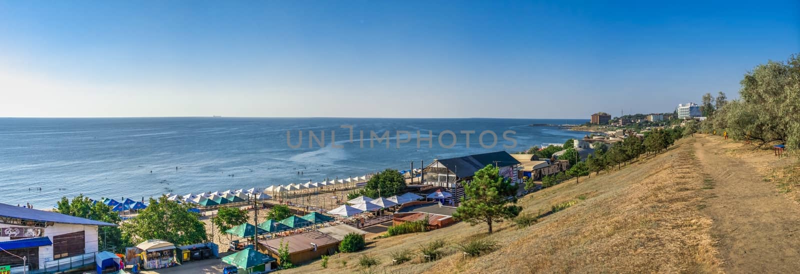 Chernomorsk, Ukraine 08.22.2020. Panoramic view of the Public beach in Chernomorsk city on a sunny summer morning