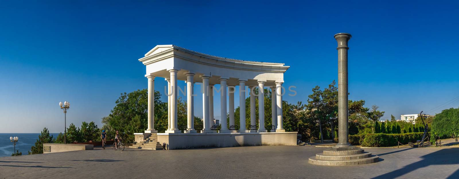 Chernomorsk, Ukraine 08.22.2020. Colonnade and Obelisk of Glory in Chernomorsk city on a sunny summer morning