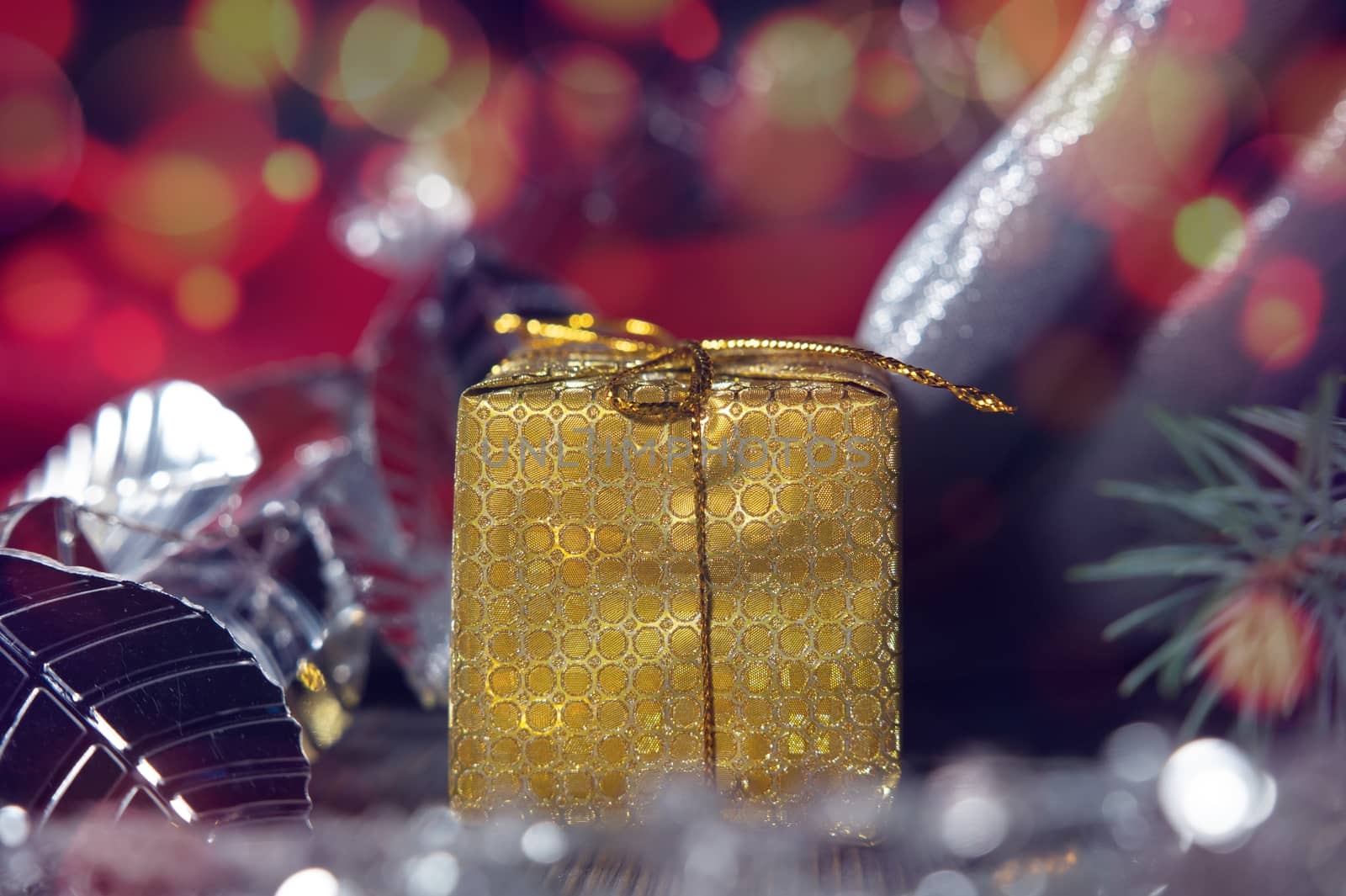 Festive Christmas background with golden gift and assorted decorations