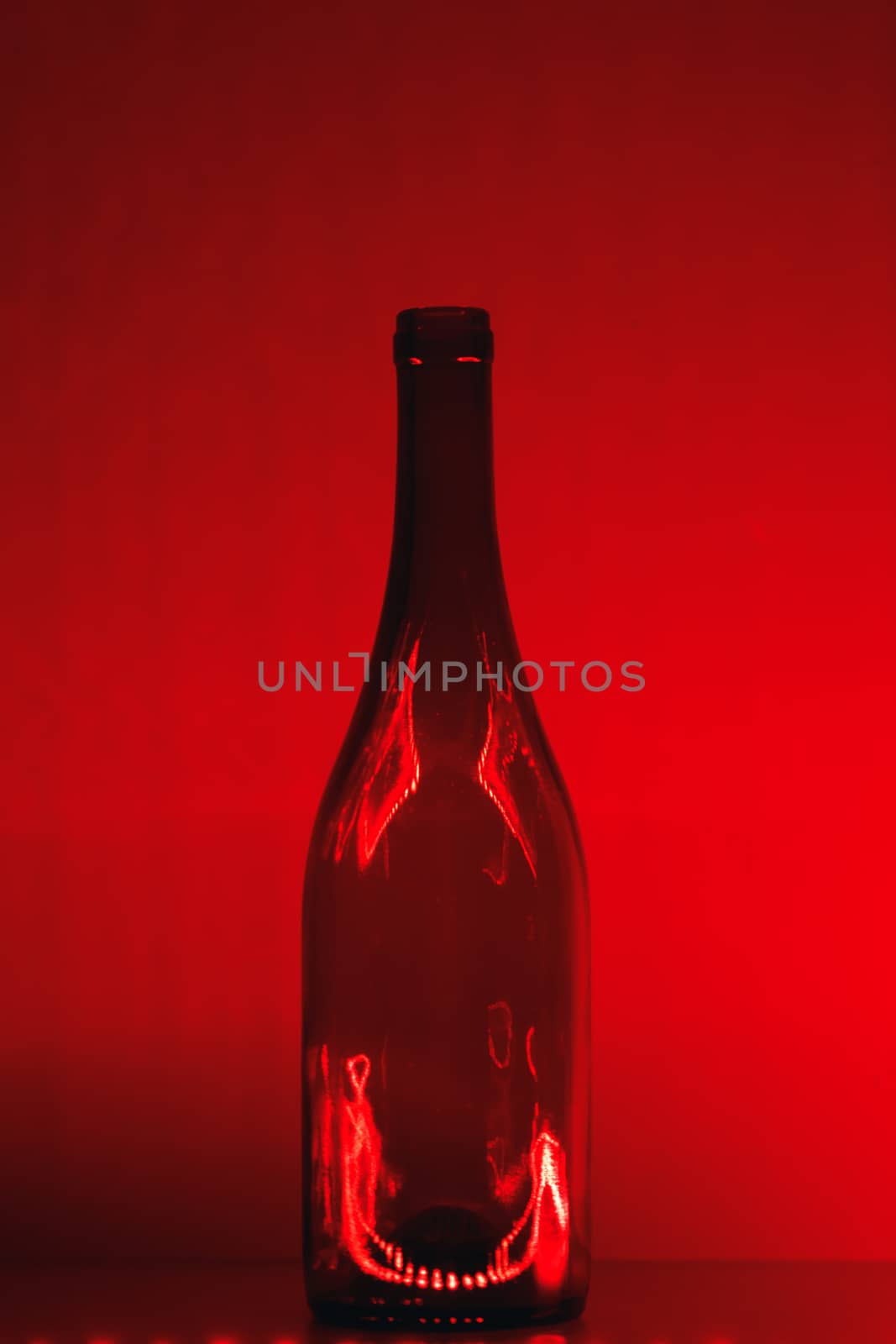 abstract empty wine bottle with red led illumination by nikkytok