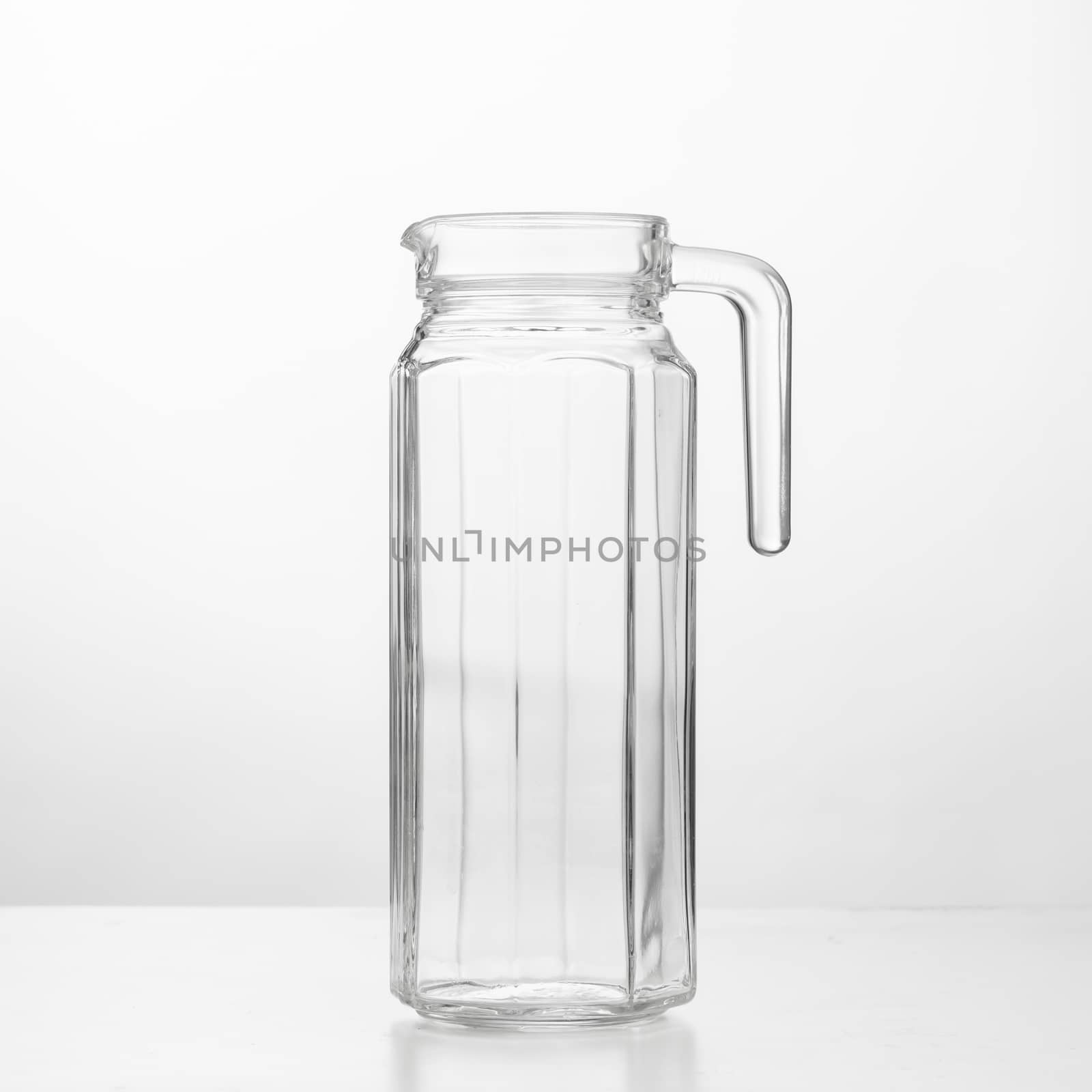 empty glass jug, white background by nikkytok