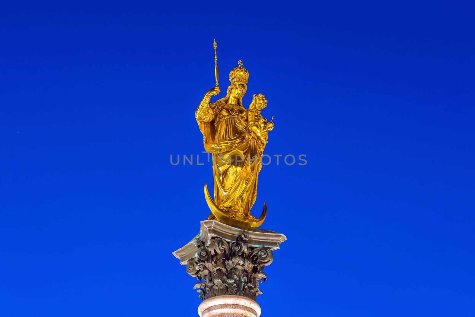 Steeple of the Peace Column with famous golden Angel of Peace statue in Munich, Germany