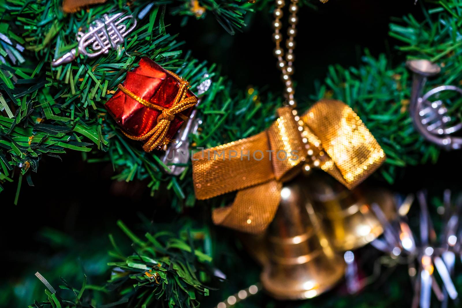 Christmas hanging decorations on fir tree. Decorated Christmas tree. Fir branch with Christmas baubles decorations.