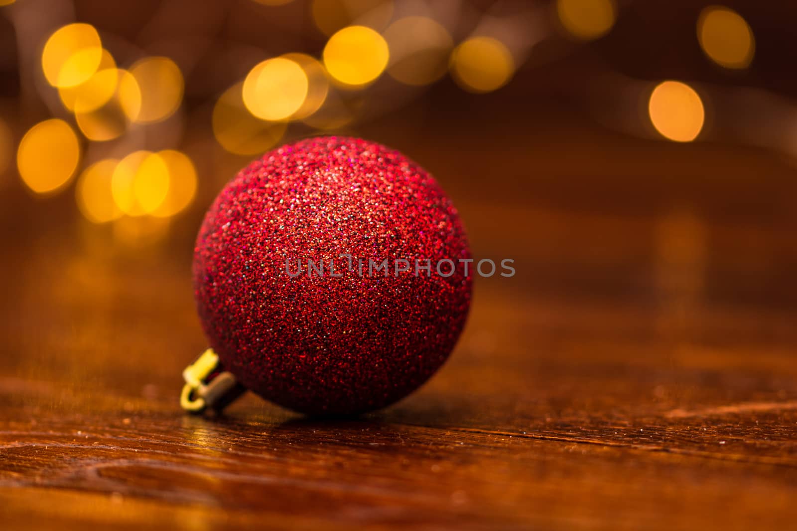 Colorful Christmas ball isolated on blurred and shiny background by vladispas