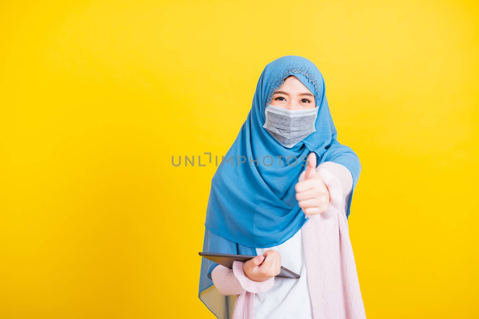 Asian Muslim Arab woman Islam wear veil hijab and face mask prot by Sorapop