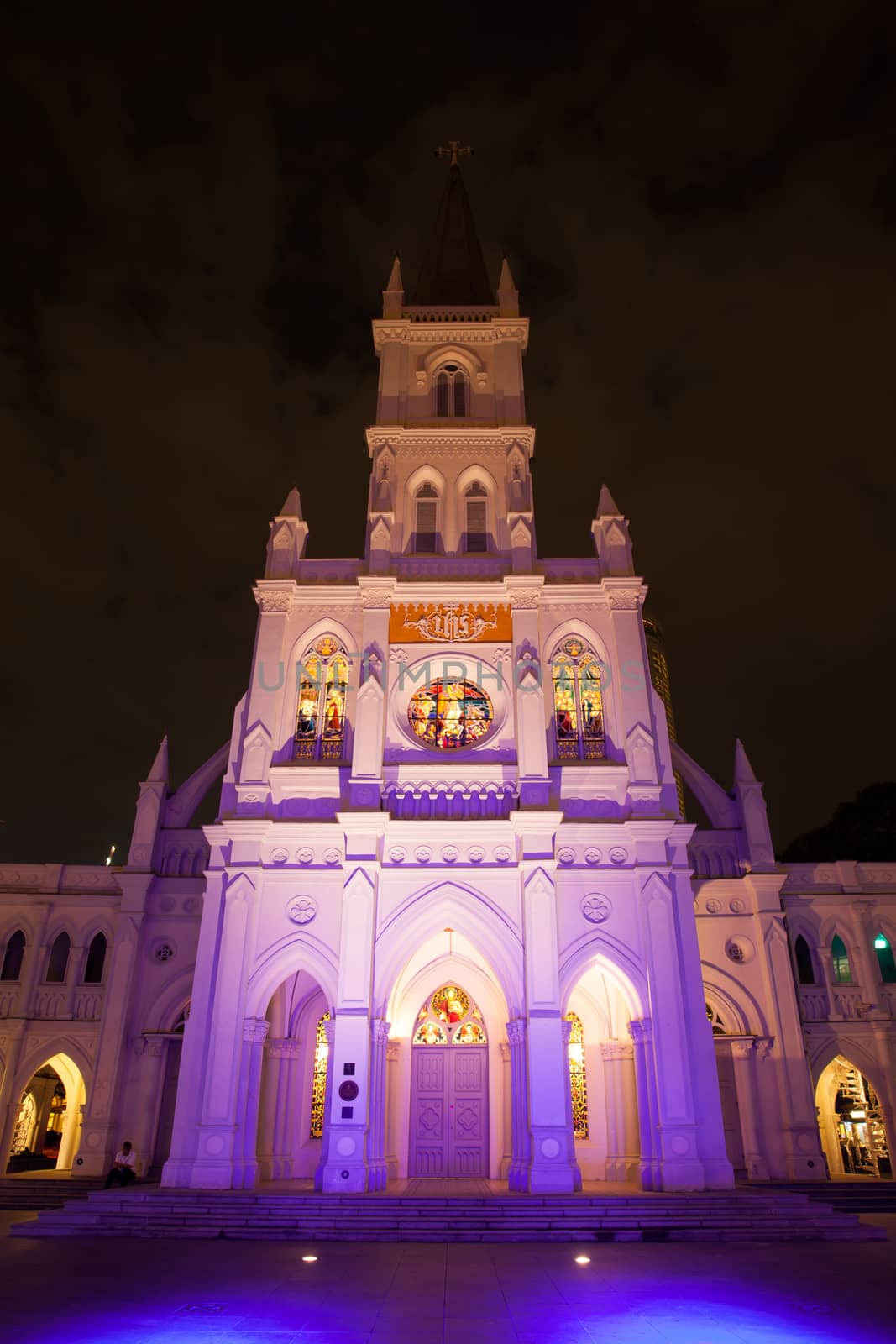 Singapore CBD, Singapore - April 12th 2014: Illuminated St Andrew's Cathedral on a warm Singaporean night