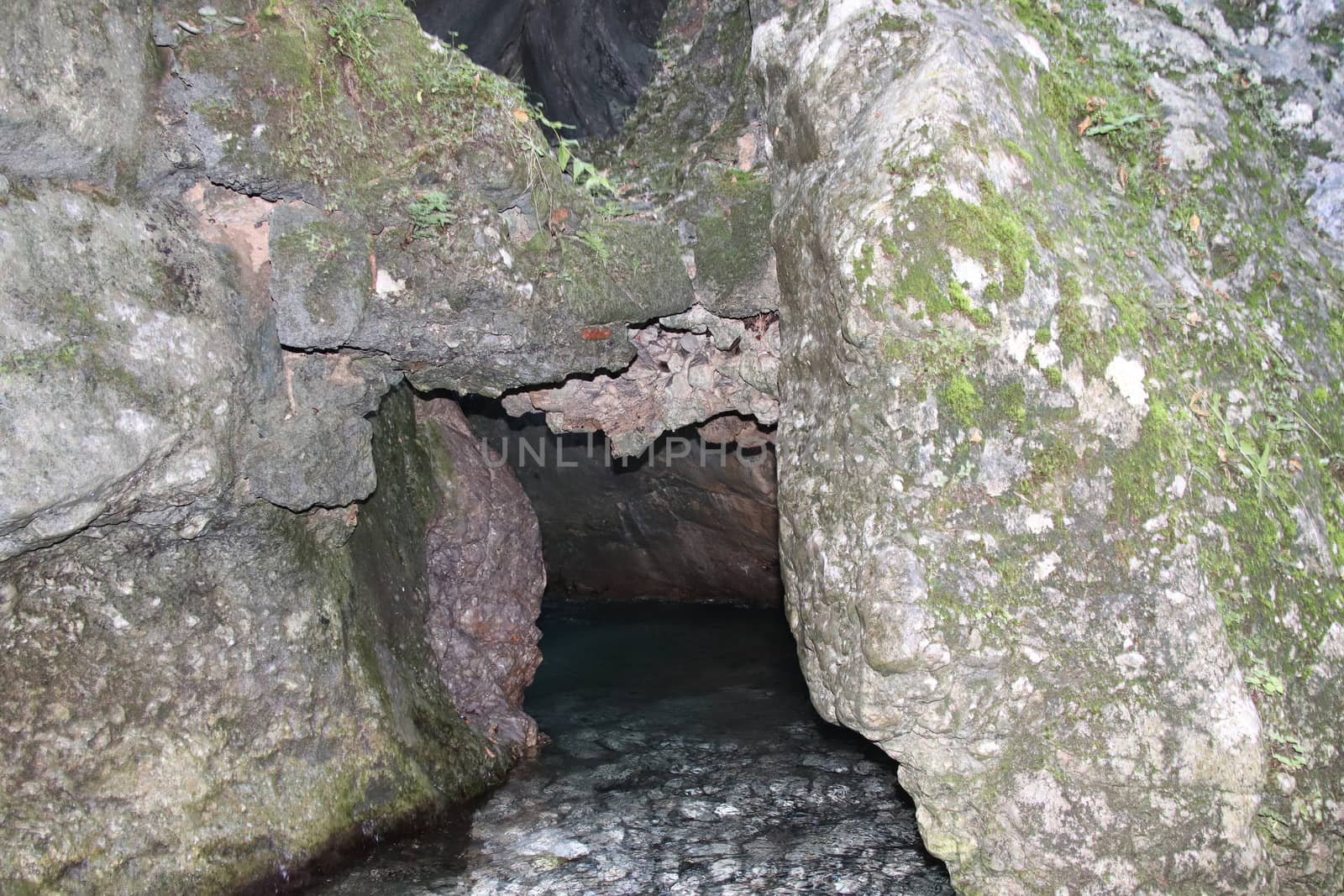 natural view with underground river between the rocks