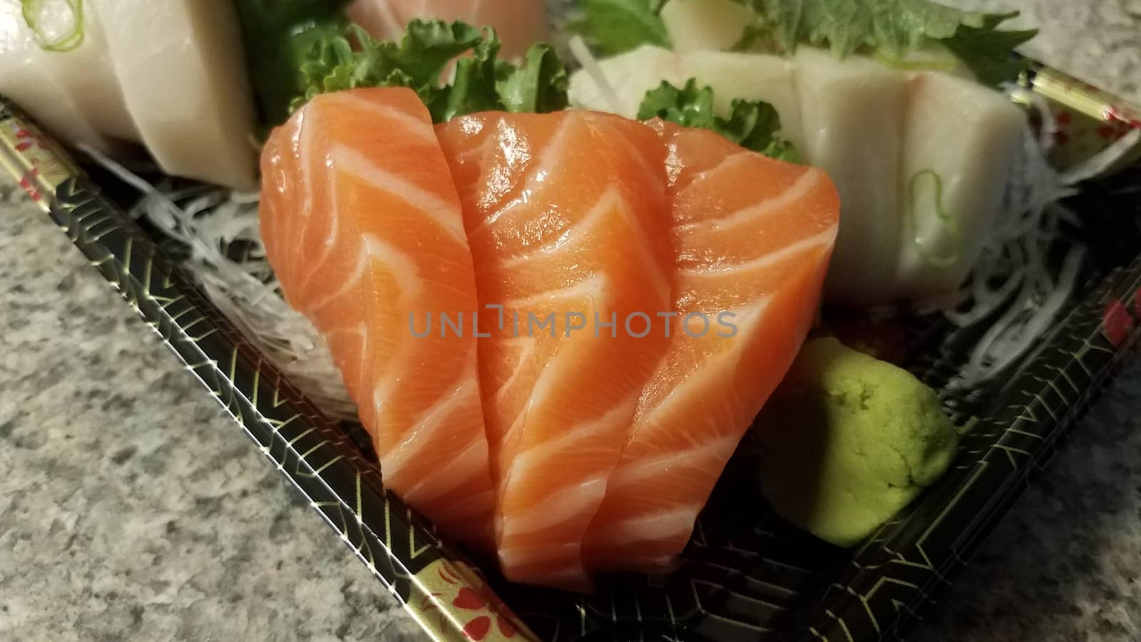 orange salmon sushi and other fish in container by stockphotofan1