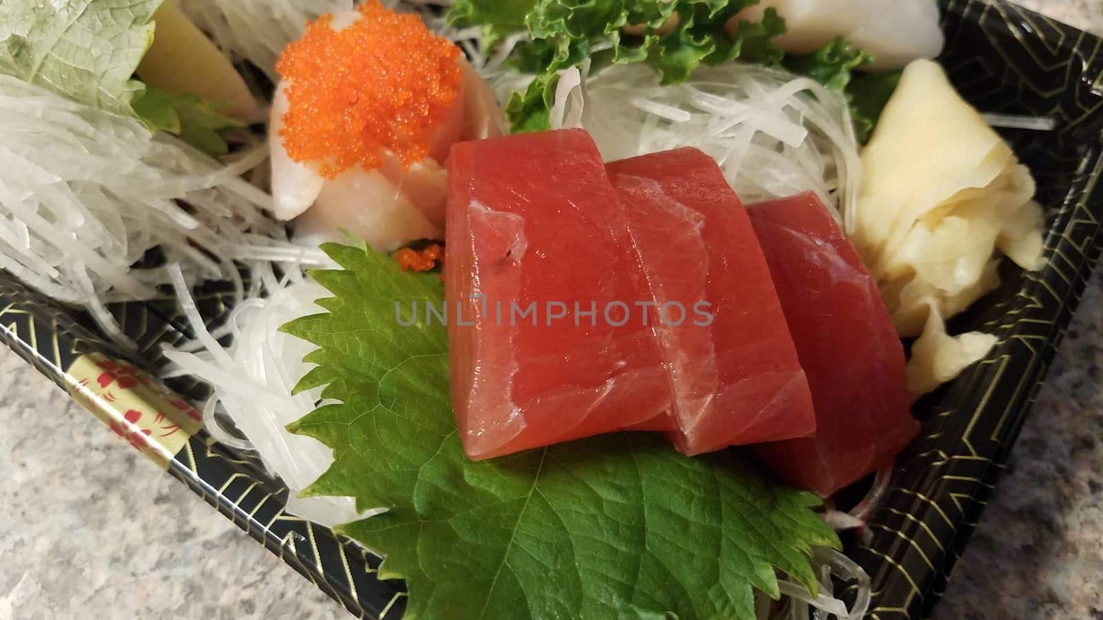 red tuna sushi seafood and other fish in container