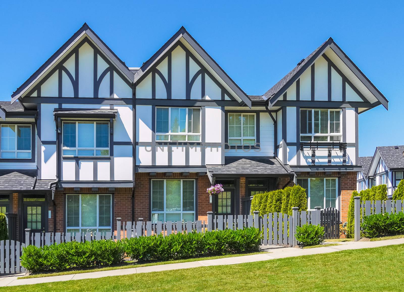 Row of new townhouses on bright sunny day