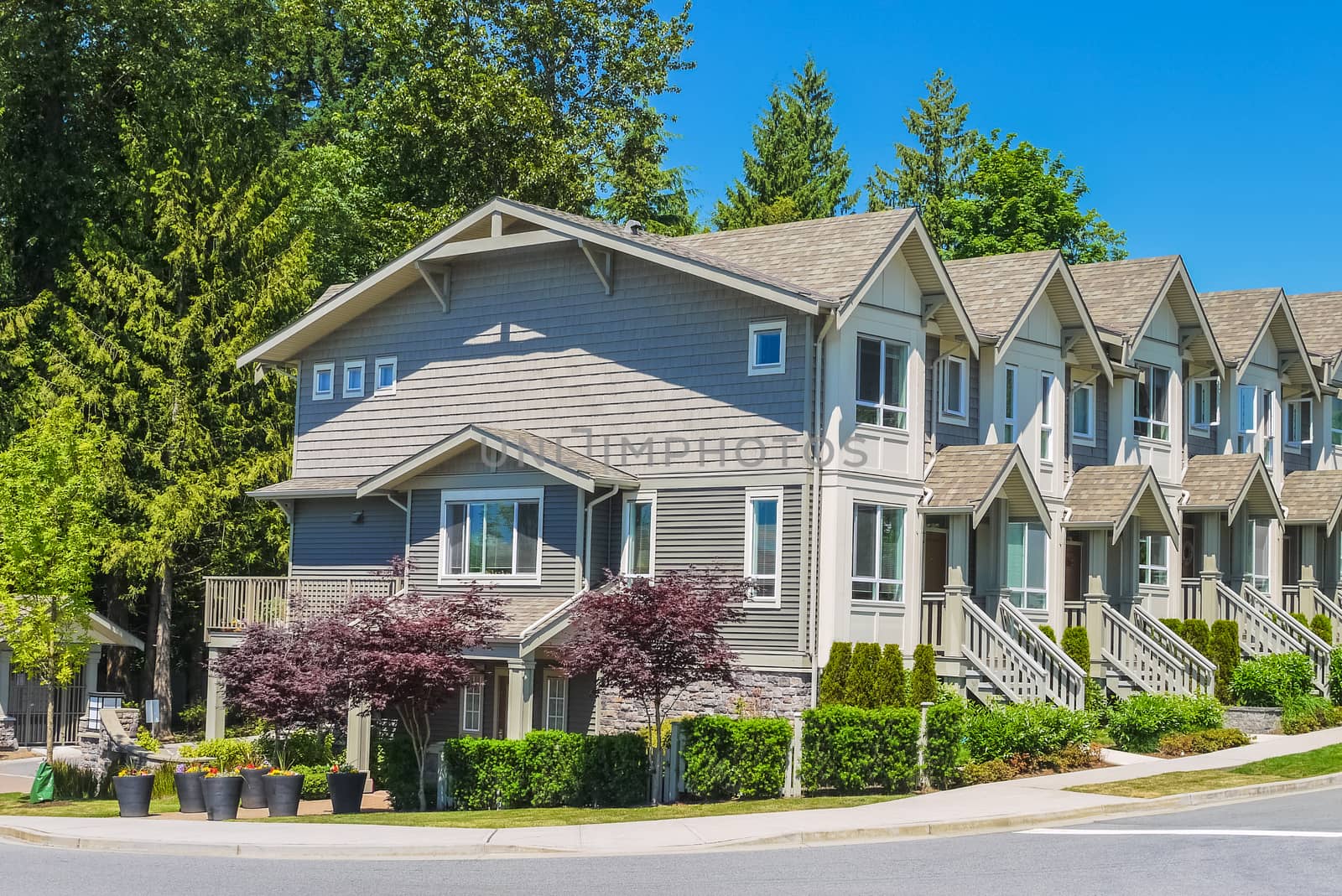 Row of new townhouses with side entrance from the street