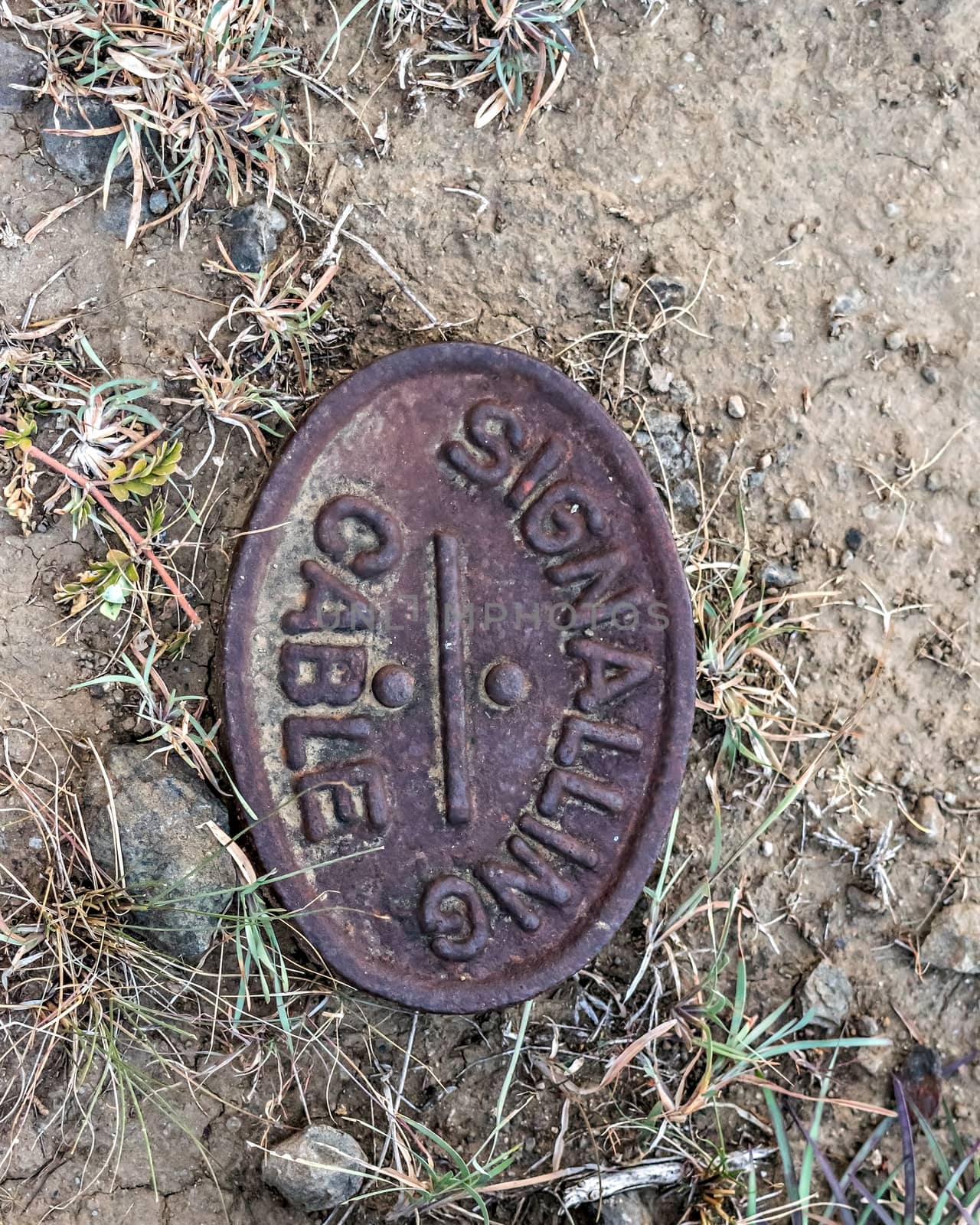 Old signal cable location marker used in railways during British era in India.