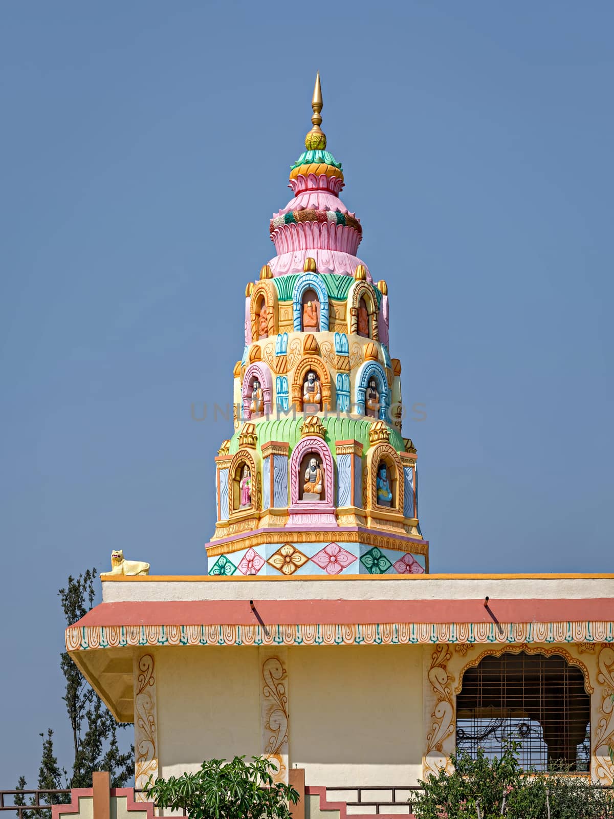 Colorful dome of village side Indian temple near Saswad,Maharashtra,India. by lalam