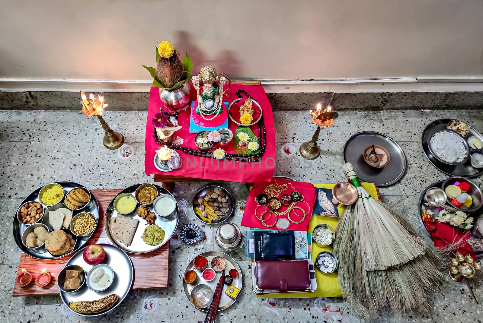 Whole set of hindu pooja articles neatly systematically arranged before performing goddess Laxmi pooja.