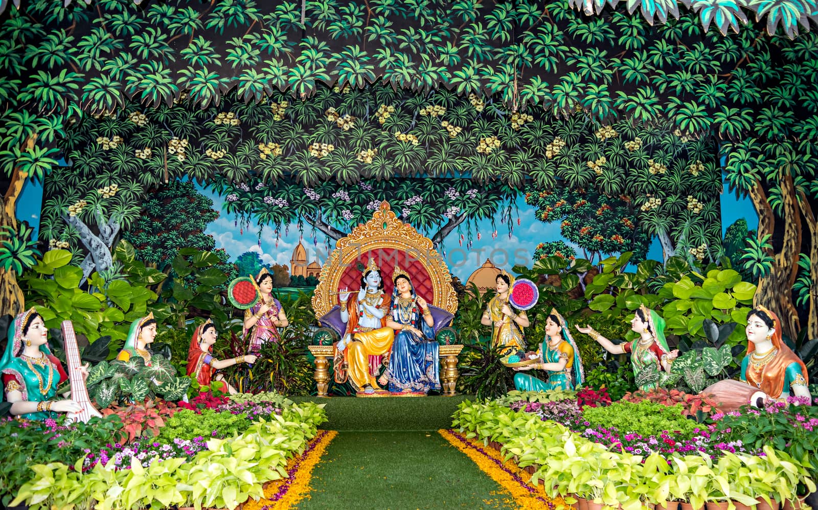 Colorful life size idols of Hindu god ,Lord Krishna,Radha and Gopis sitting at Prem Mandir temple complex in Vrindavan,Mathura.