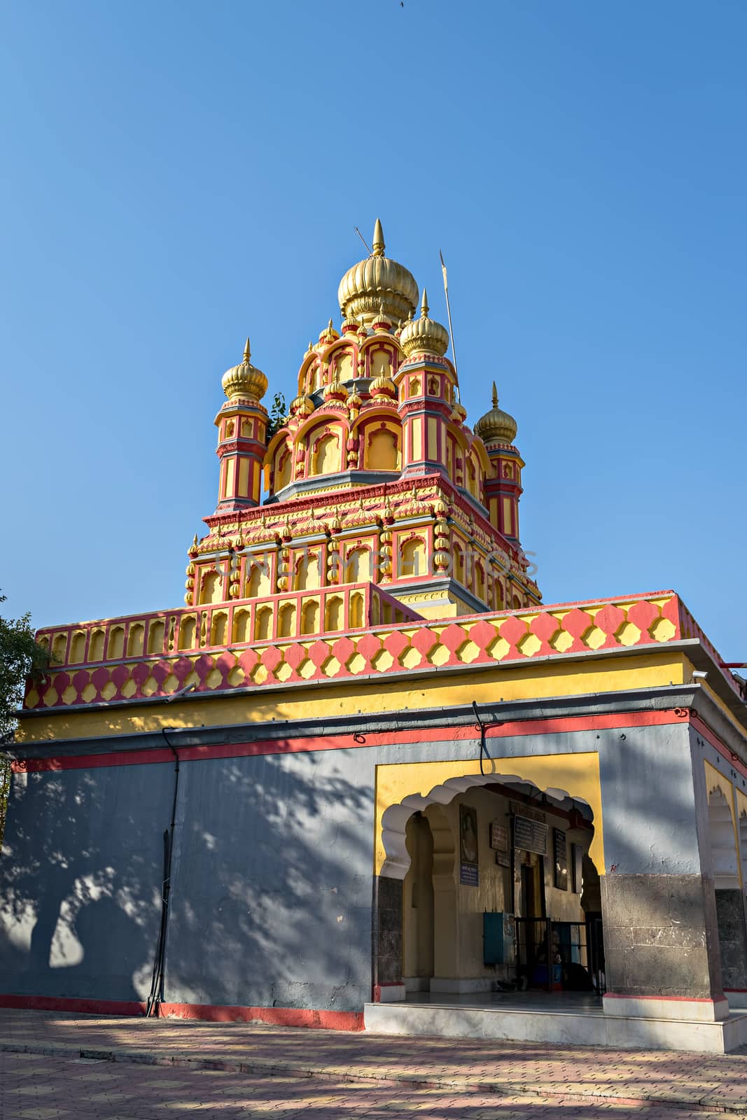 oldest heritage structure in Pune-Parvati temple on a clear blue sky background. by lalam