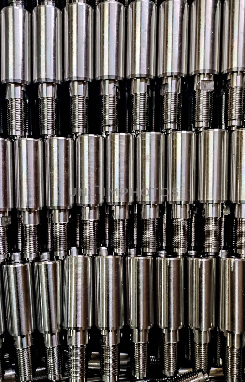 Close up image of stainless steel turned components. by lalam