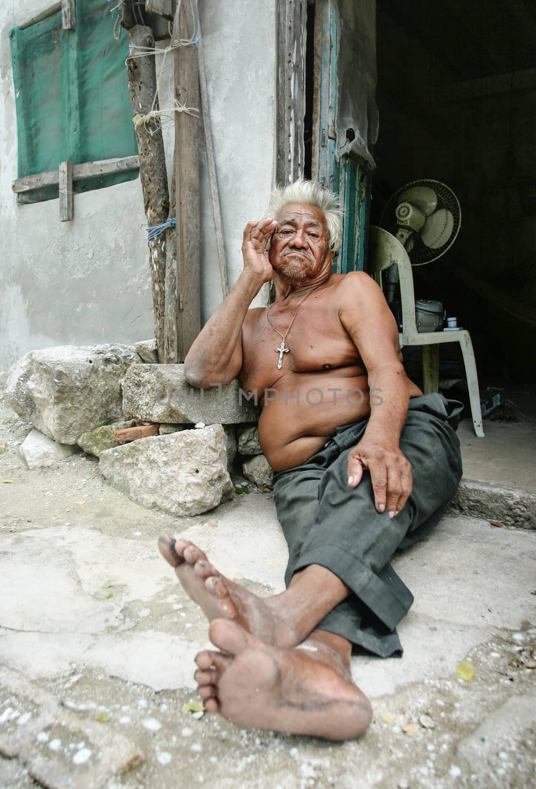 Celestun, Mexico - October 9, 2007: Celestun resident sitting to by Ivanko