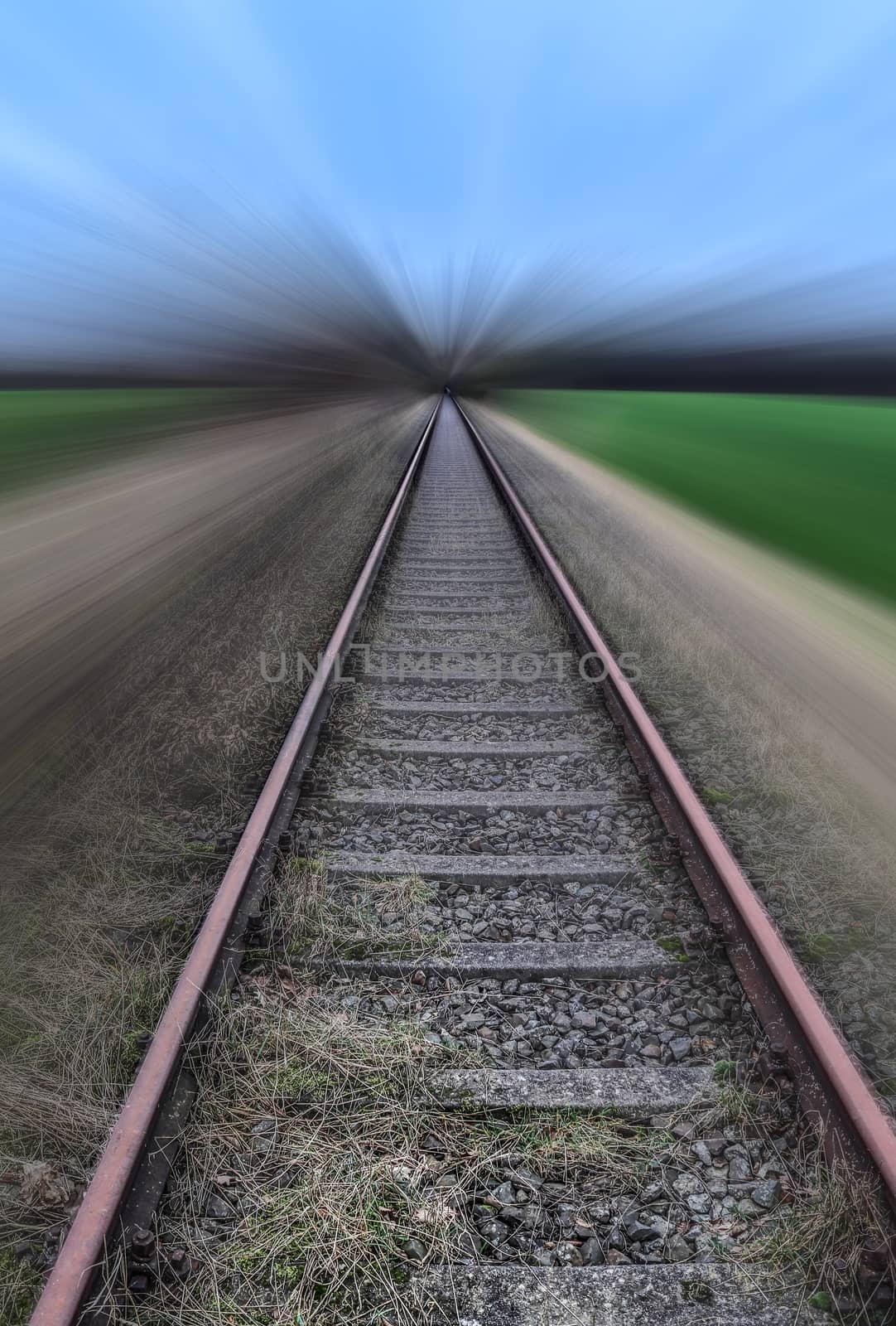 Diminishing perspective view at a railroad track with high speed motion blur