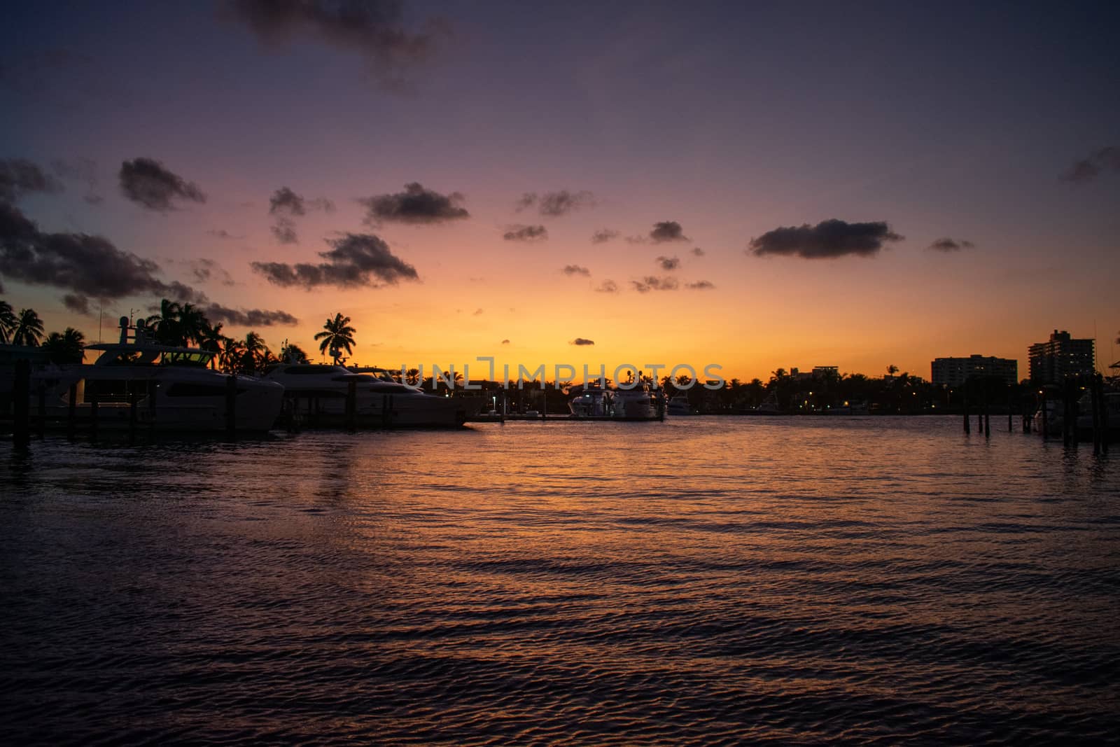 A Purple and Orange Sunset in a Tropical Location by bju12290