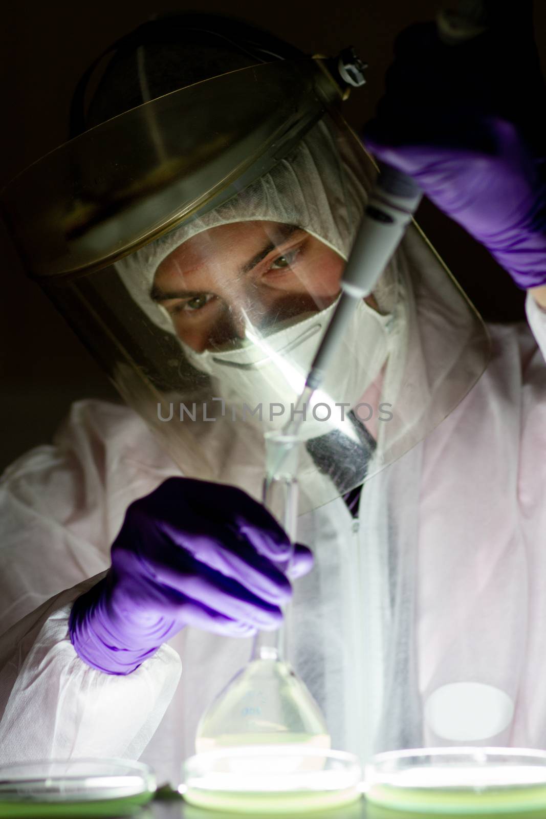 Scientist working in the corona virus vaccine development laboratory research facility. Corona virus pandemic concept. Development of virus treatment drug.