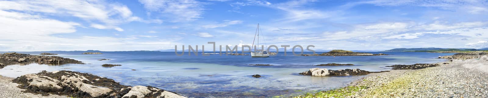 Panoramic view of sailing boat moored at Ronachan Point, Kintyre off the West coast of Scotland