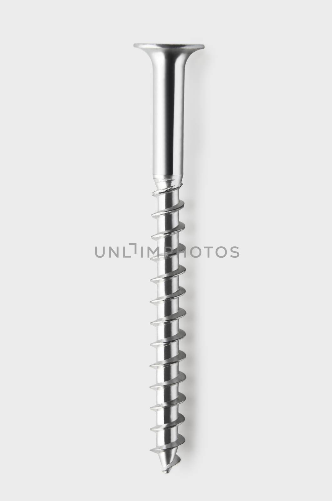 Overhead view of a single screw isolated on white background