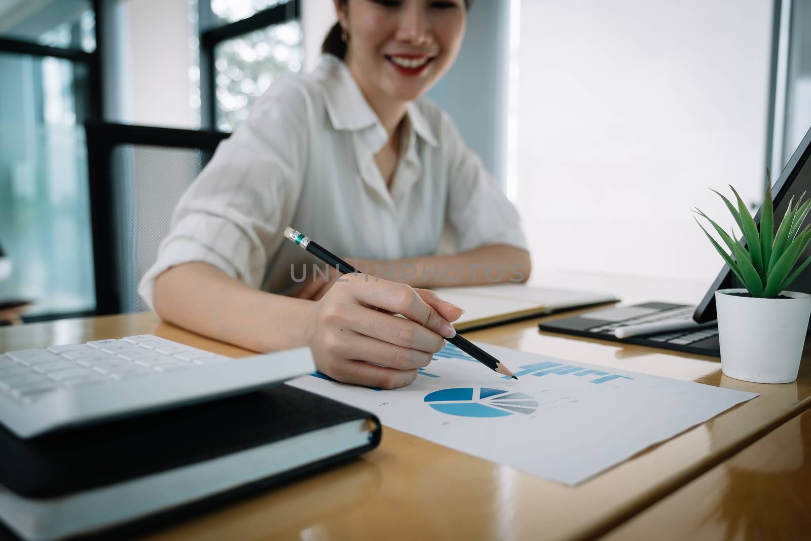 usiness man investment consultant analyzing company annual financial report balance sheet statement working with documents graphs. Concept picture of business, market, office, tax by nateemee