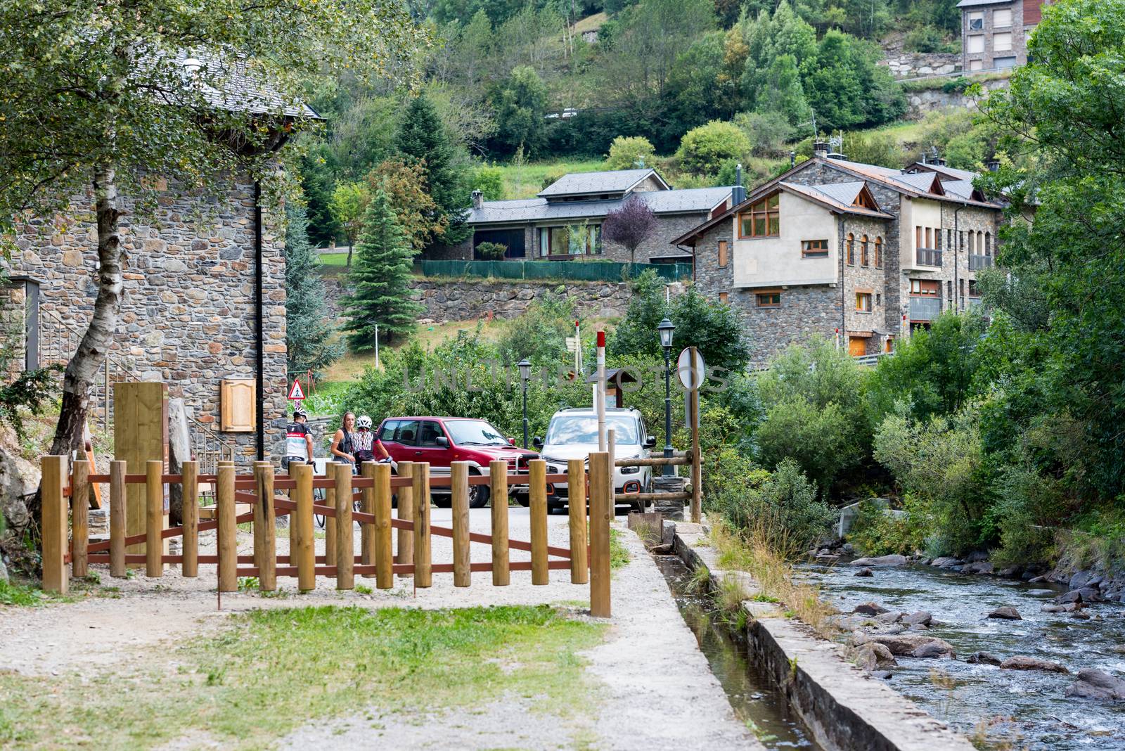 Ordino, Andorra: 26 August 2020: People enjoying the Valira del Orient river in Cami Ral in summer in Andorra.