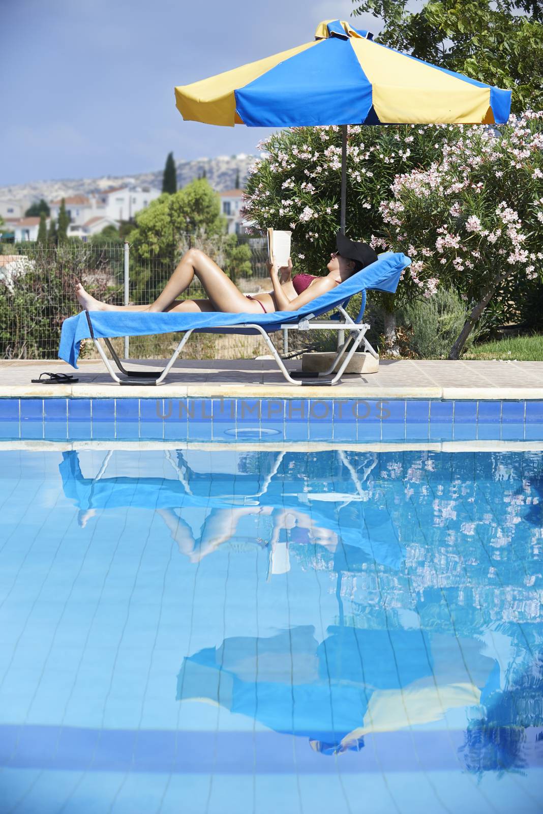 Young Woman Sunbathing In Bikini by gemphotography